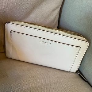 White leather Coach wallet.